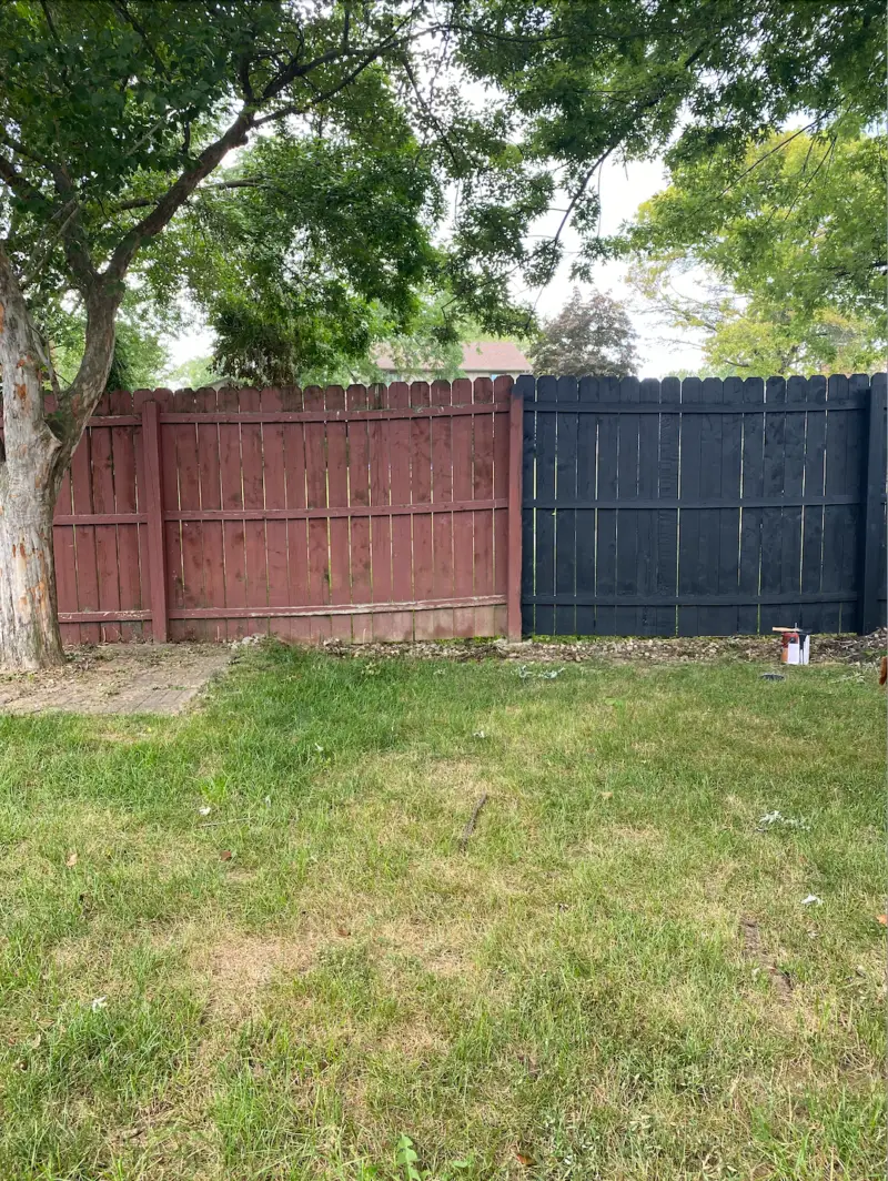black wood fence before and after