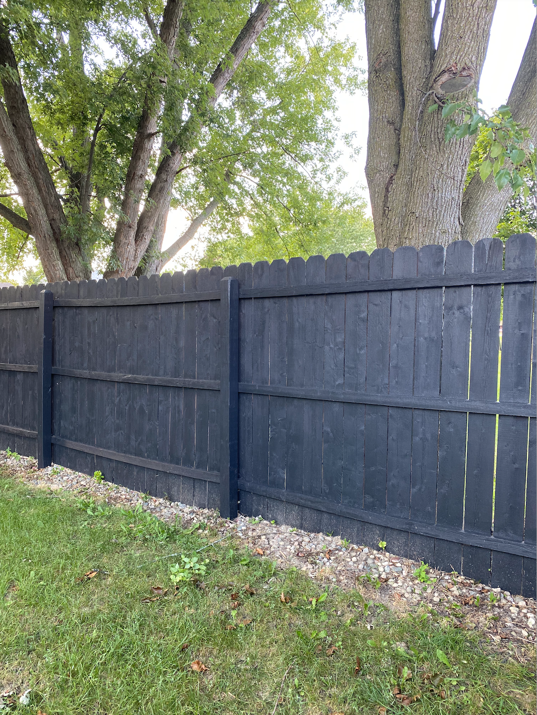 black fence backyard